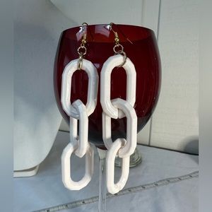 Three white chain link earrings